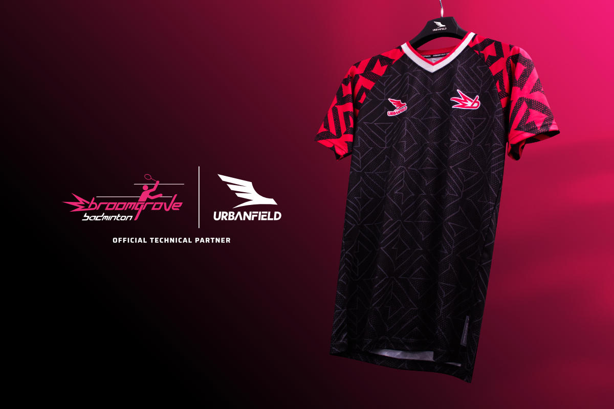 Broomgrove Badminton Club shirt on a black hanger in front of a pink and black gradient background.