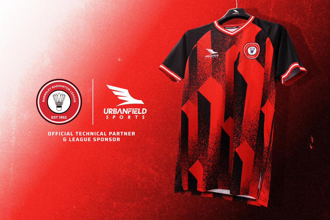 Barnsley Badminton League shirt on a black hanger in front of a dark red gradient background.