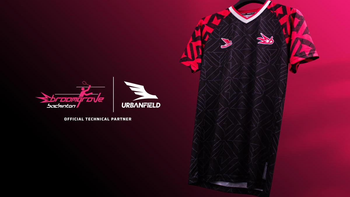 Broomgrove Badminton Club shirt on a black hanger in front of a pink and black gradient background.