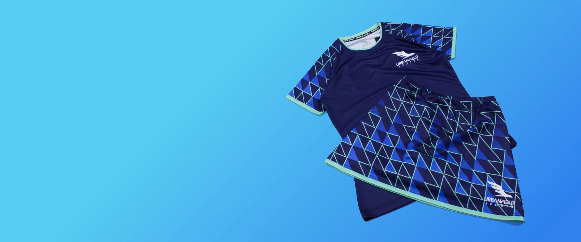 Women's Urbanfield Sports navy blue Tri-I short sleeve t-shirt and matching skort on a light blue background.