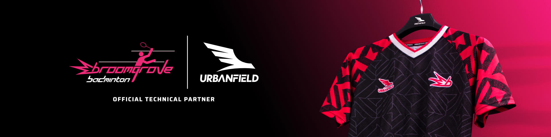 Broomgrove Badminton Club shirt on a black hanger in front of a pink and black background.