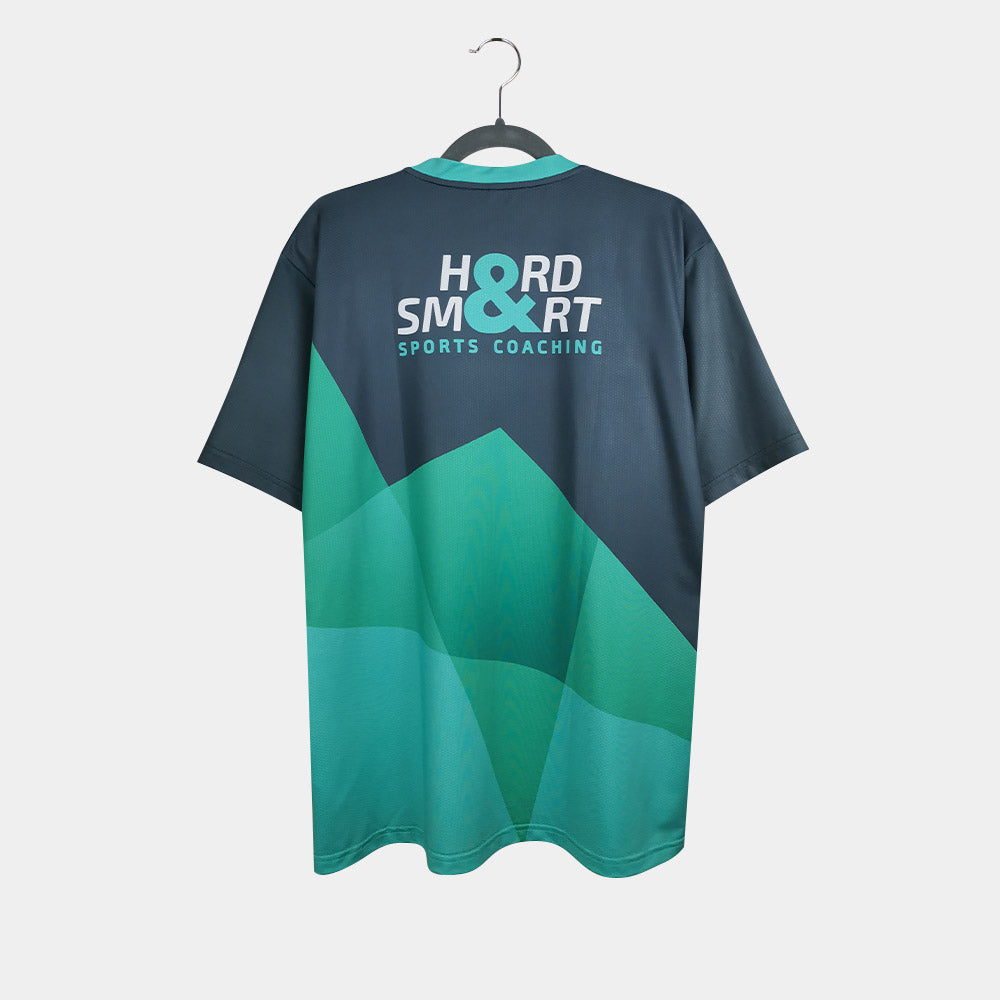 Rear view of men's Hard & Smart Sports Coaching T-shirt in graphite grey and mint green