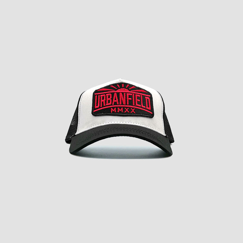 Front view of Urbanfield Sports sunset trucker cap in black and white