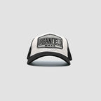 Front view of Urbanfield Sports sunset trucker cap in black and white