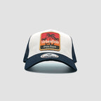 Front view of Urbanfield Sports palm beach trucker cap in navy blue and white